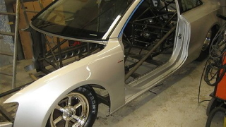 Illustration for article titled Watch an Audi A5 transform into a drag car